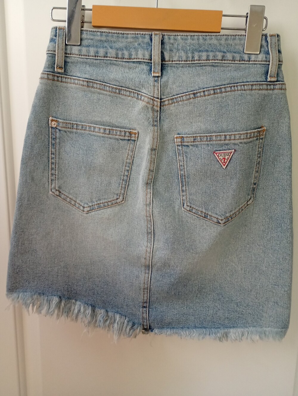 GUESS I Light Wash Denim Short Skirt with Frayed Hem | XS